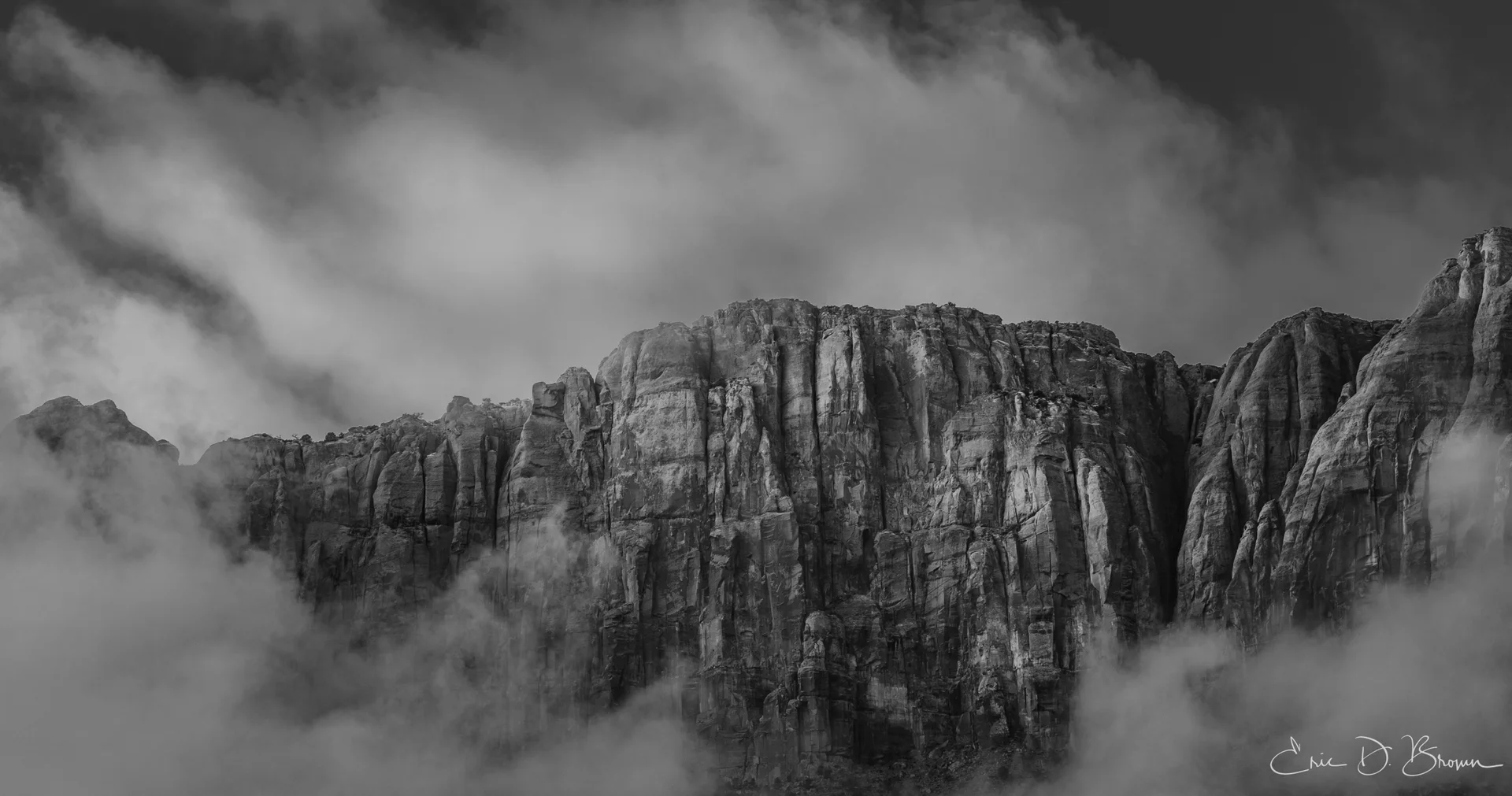 Veiled Monoliths: When Clouds Embrace the Cliffs
