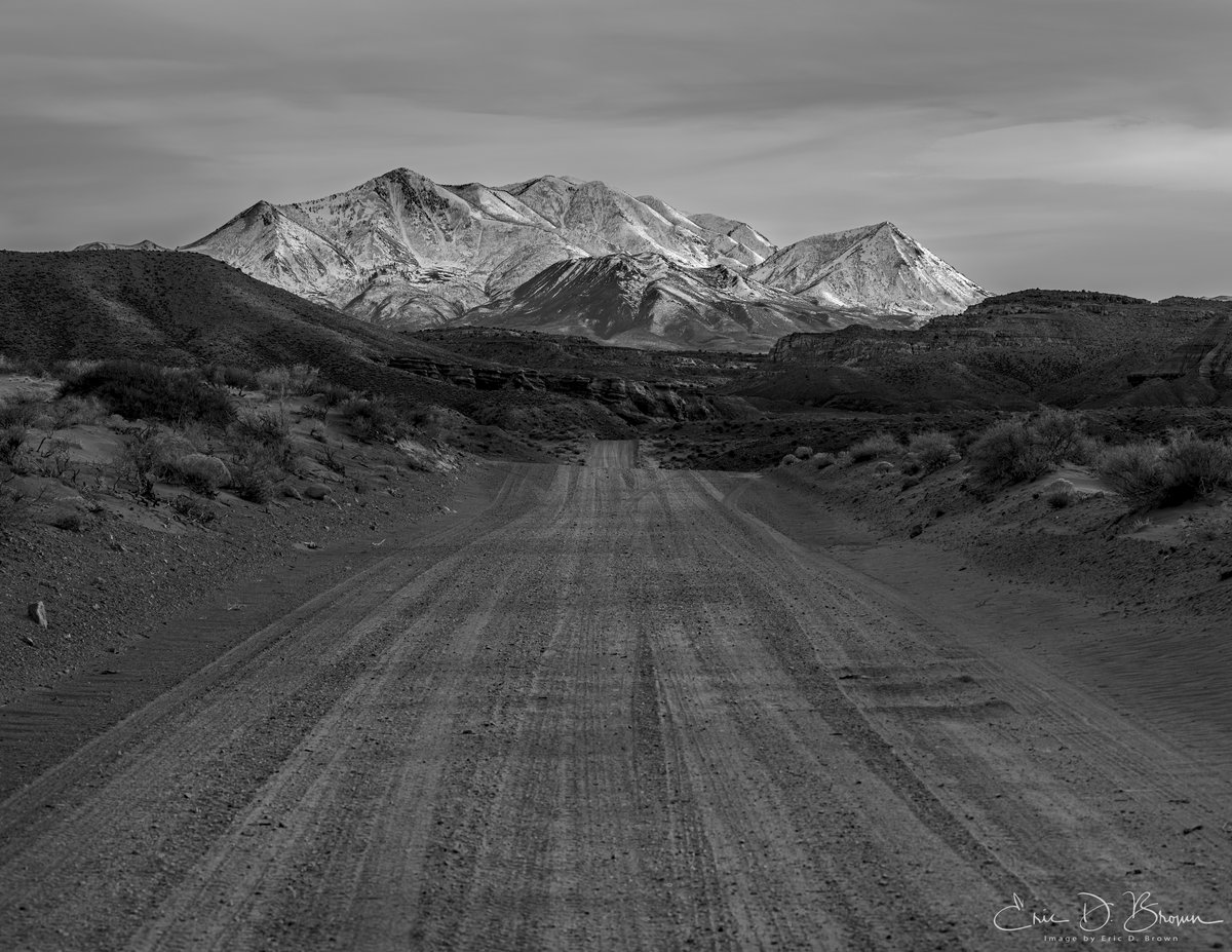 The Road to the Henry Mountains -  A dirt road leads toward the snow-capped Henry Mountains near Hanksville, Utah. Sometimes the simplest compositions work best.