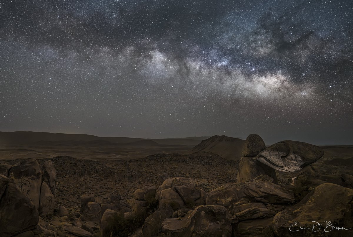 Balanced Rock Under Starlit Skies -  The ancient silhouette of Balanced Rock stands sentinel against the spectacular backdrop of the Milky Way in this breathtaking nighttime landscape from Grapevine Hills in Big Bend National Park. A subtle light illuminates the iconic formation from below, creating a dramatic contrast between earth and sky.